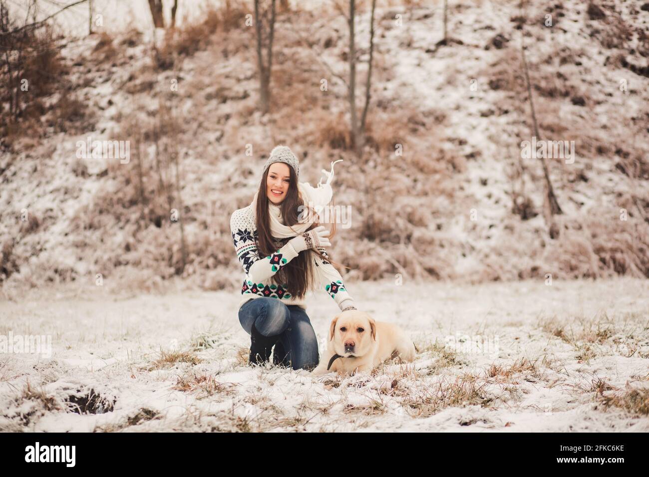 Girl with dog playing in the park Stock Photo - Alamy