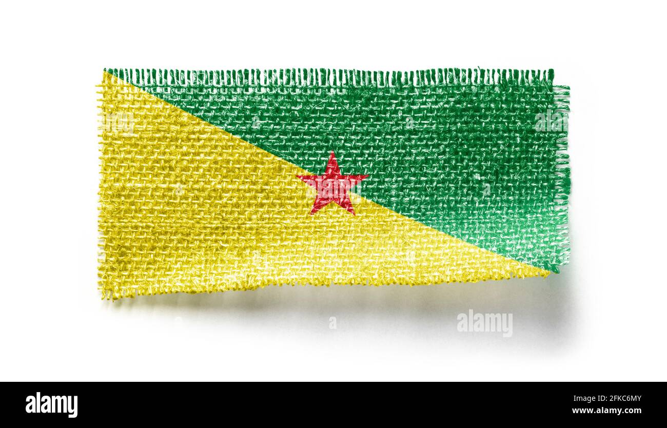 French Guiana flag on a piece of cloth on a white background Stock Photo
