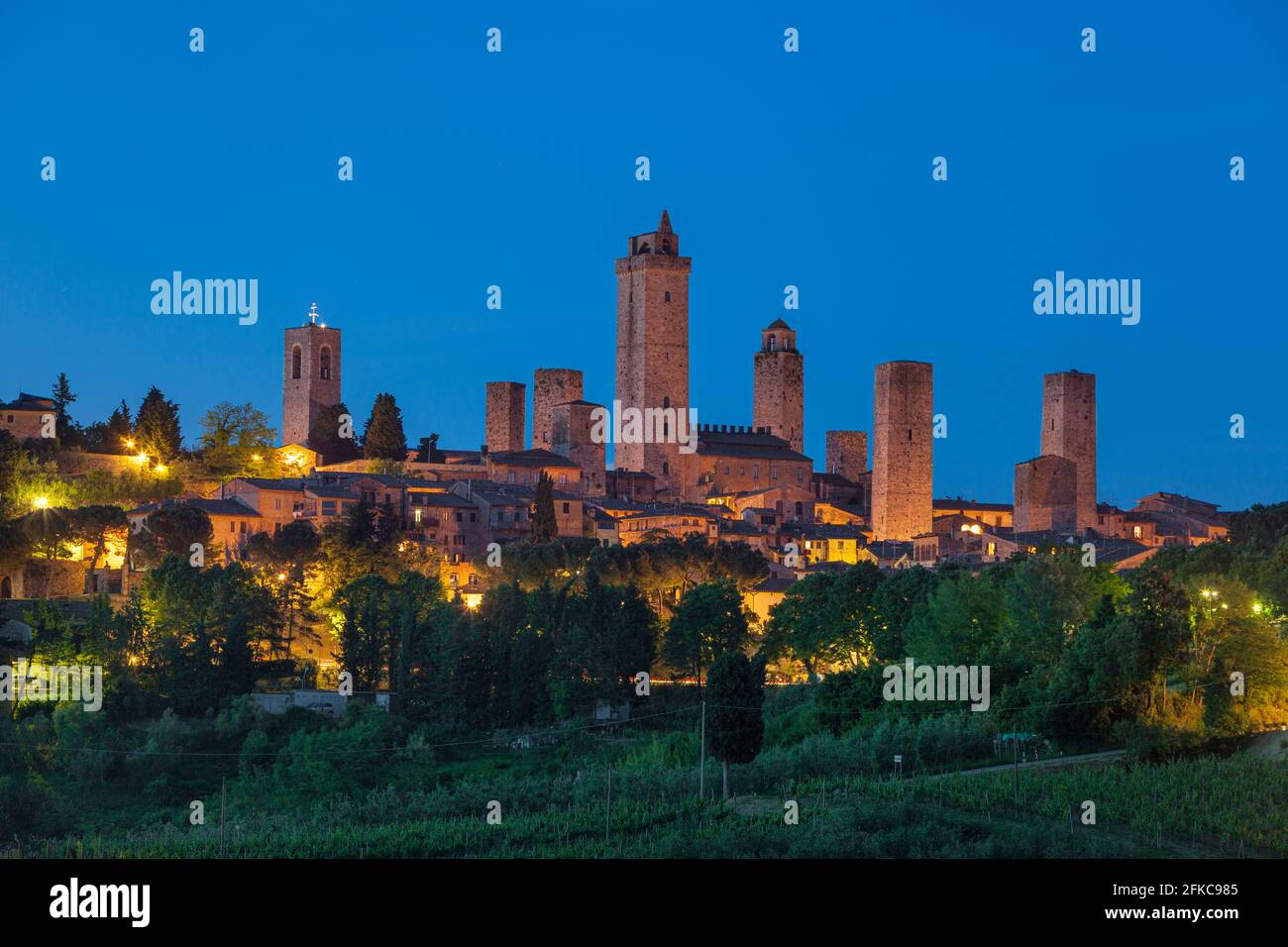 Twilight over the towers and medieval town of San Gimignano, Tuscany, Italy Stock Photo