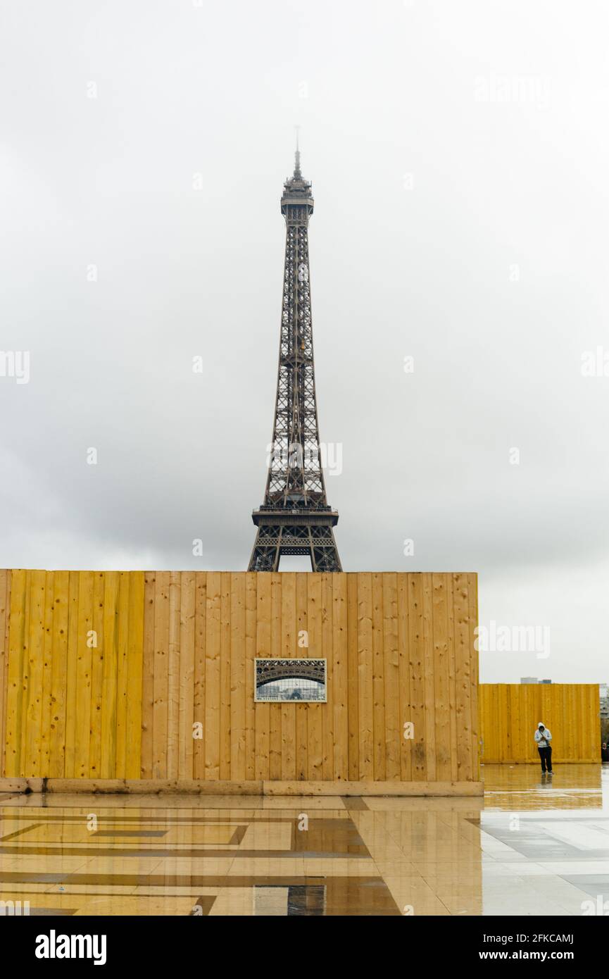 People looking at and walking around the construction site secure