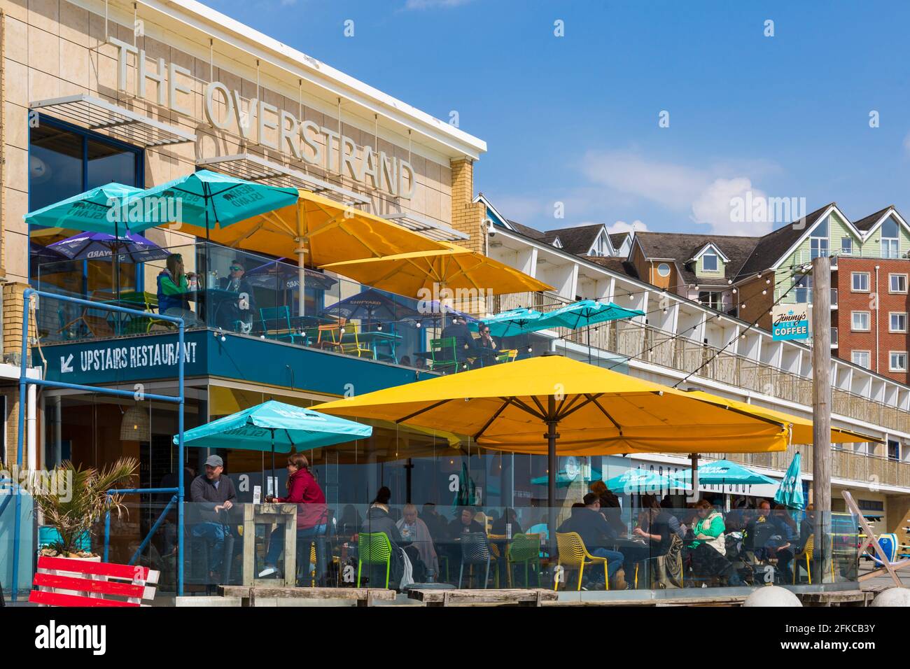 Bournemouth, Dorset UK. 30th April 2021. UK weather: after a sunny start, grey skies and rain at Bournemouth, as few visitors head to the seaside as the long Bank Holiday weekend approaches. Diners shelter from the rain at the Overstrand, Boscombe. Credit: Carolyn Jenkins/Alamy Live News Stock Photo
