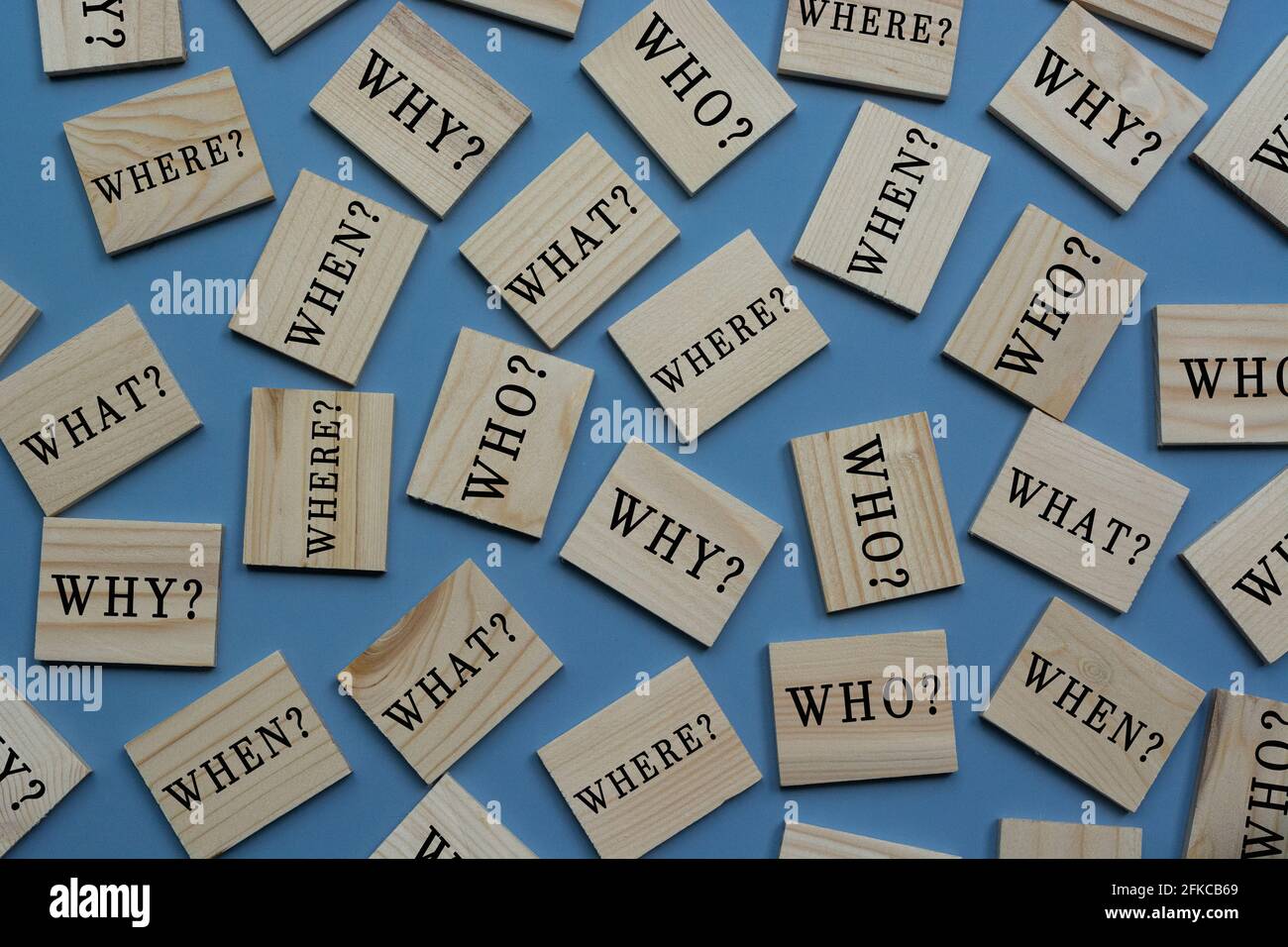 Text on wooden tile block on blue background Stock Photo