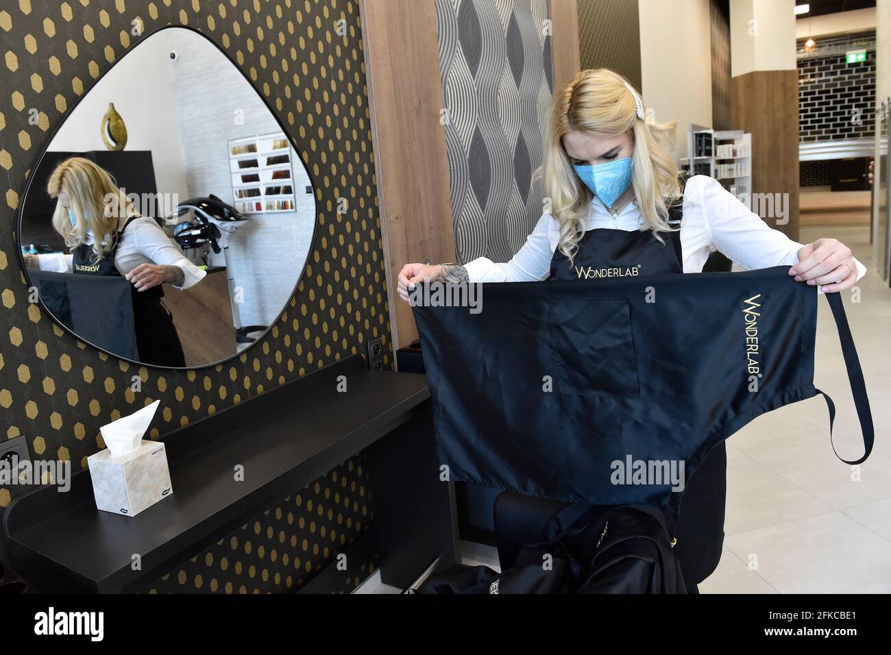 Brno, Czech Republic. 30th Apr, 2021. A hairdresser Kristyna Humlova  prepares her salon in the Futurum shopping mall in Brno, for reopening as  further coronavirus lockdown restrictions are lifted in Czech Republic.