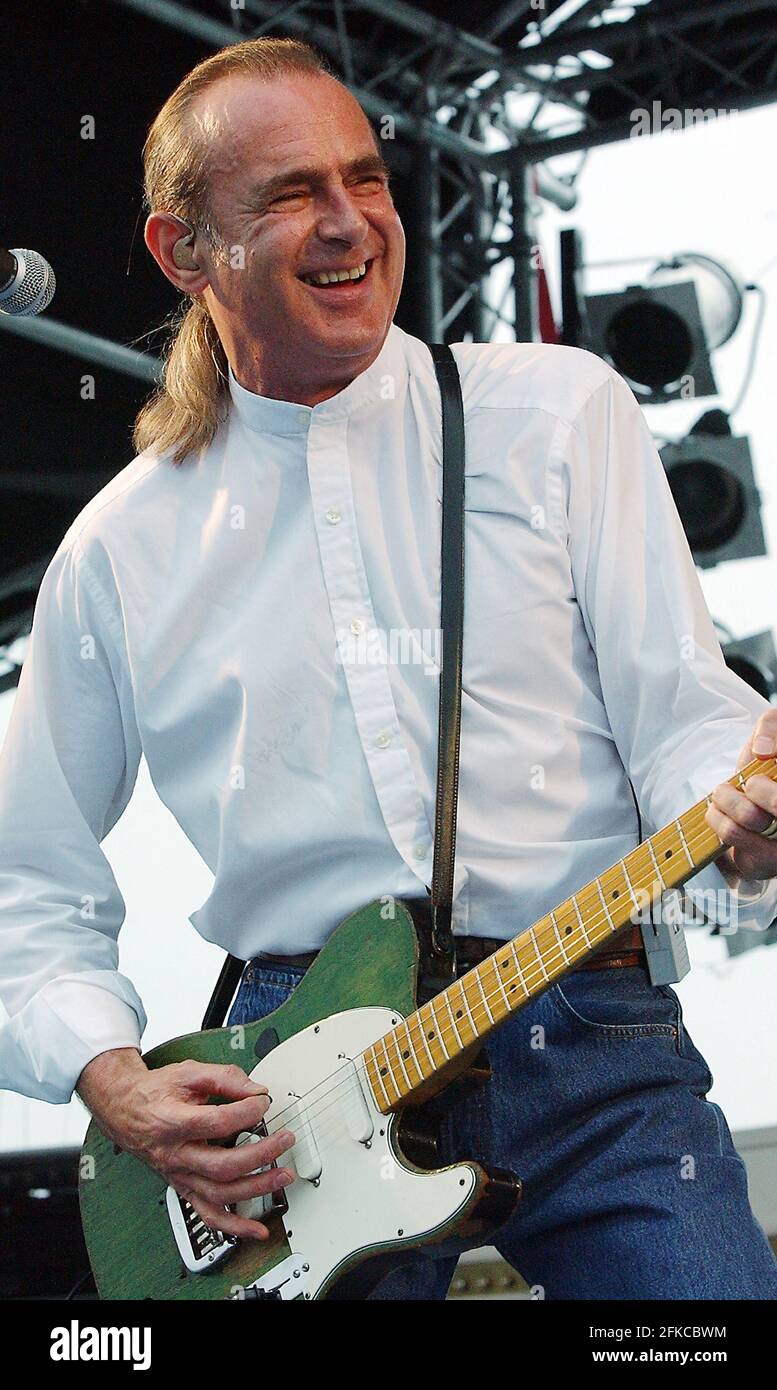 STATUS QUO'S FRANCIS ROSSI ON STAGE ABOARD HMS ARK ROYAL AT PORTSMOUTH WHERE THE BAND PERFORMED