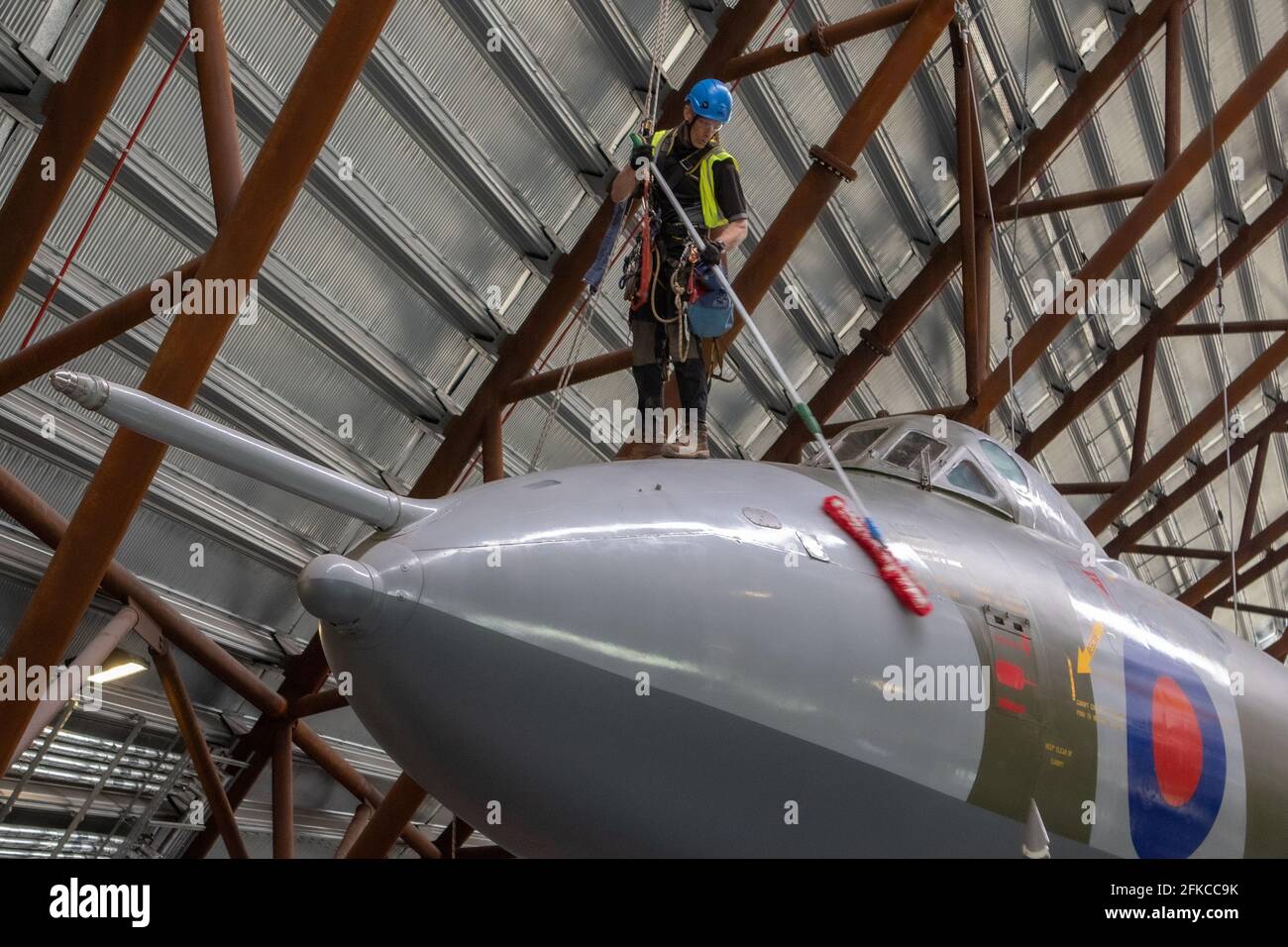 Cosford, United Kingdom, 30th April 2021. RAF Museum Cosford's National Cold War Exhibition hangar features a number of suspended and large aircraft, some of which are over a 100ft in the air. With limited or difficult access for museum staff, an annual clean of the larger and suspended aircraft along with inspection of the suspension cables is undertaken by a specialist team using a combination of both rope access and mechanical platforms. Credit: Paul Bunch/Alamy Live News Stock Photo