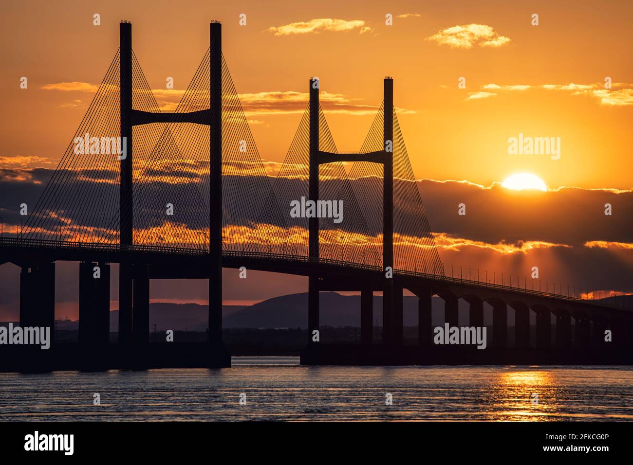 Severn Bridge crossing from England to Wales, at sunset. The bridge is also called the Prince of Wales Bridge Stock Photo