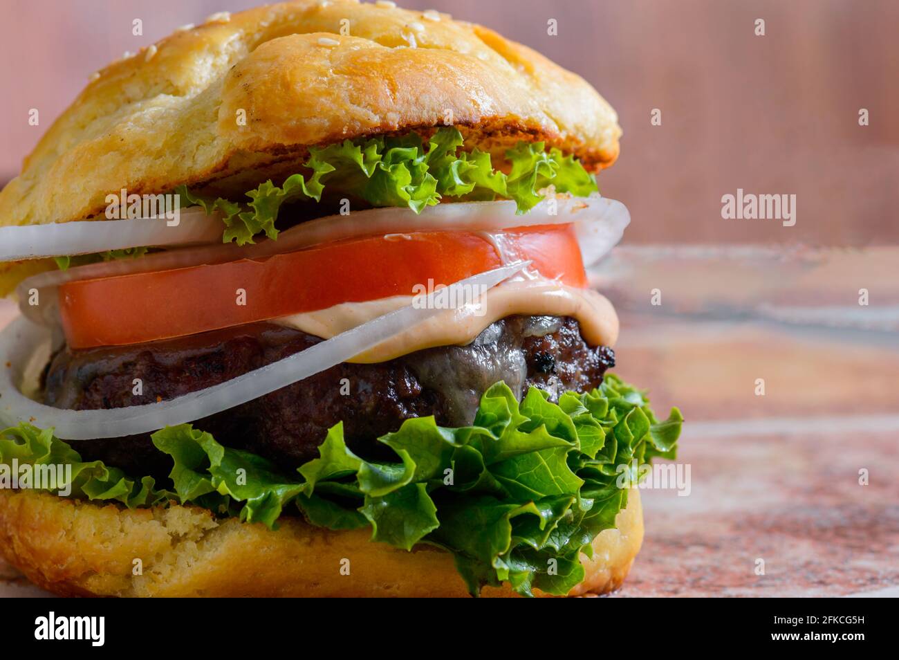 Home made barbecue cheese burgers in brioche bread buns Stock Photo