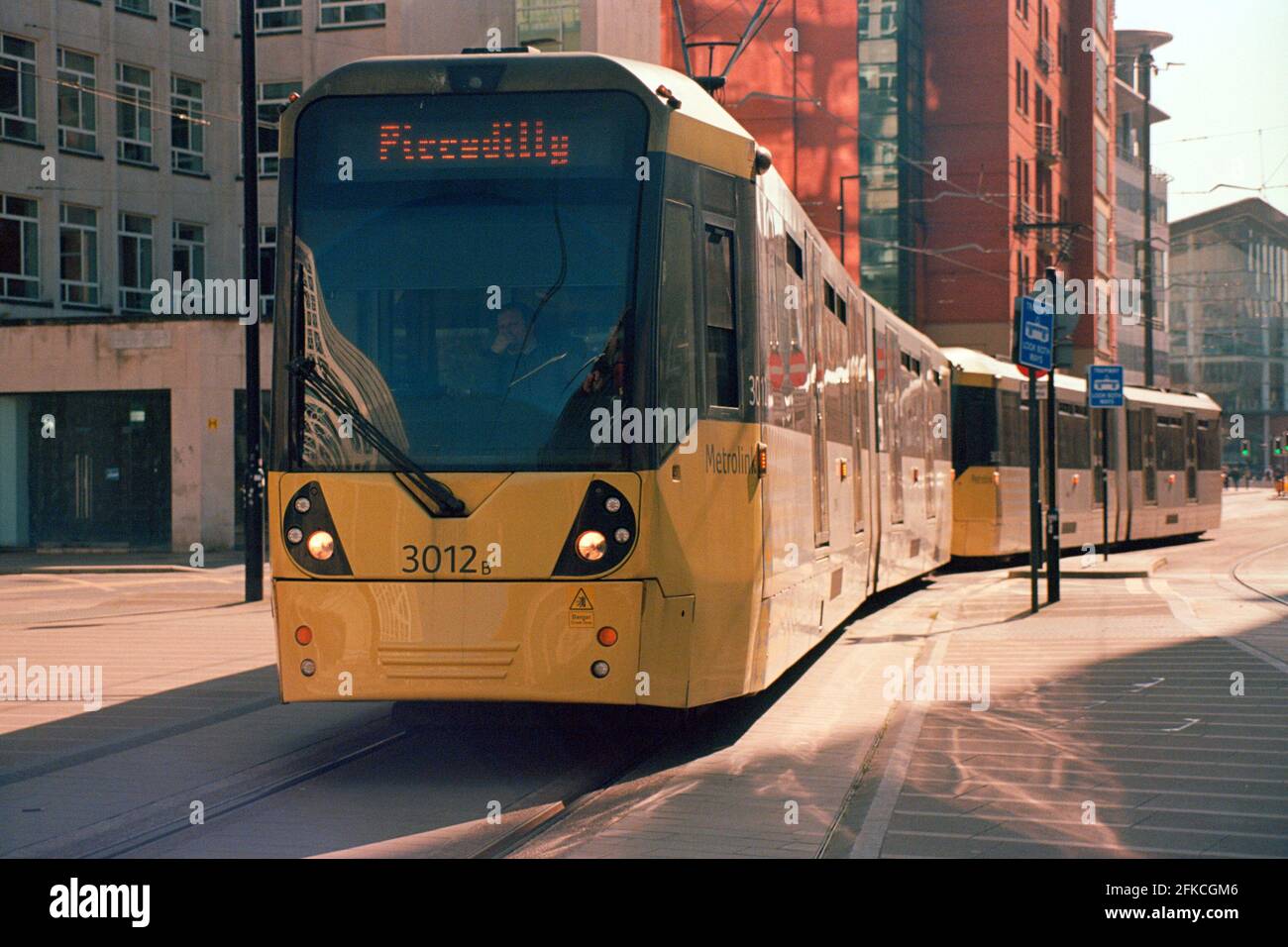 Manchester, UK - 3 April 2021: A Manchester Metrolink tram (Bombardier M5000, no. 3012) at St Peter's Square. Stock Photo