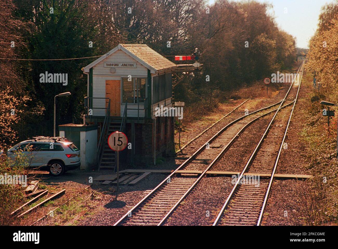 Rainford, UK - 2 April 2021: The signal box and semaphore signals at Rainford station. Stock Photo