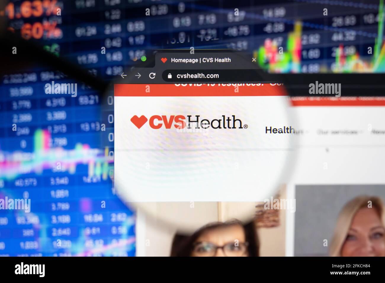 CVS Health company logo on a website with blurry stock market