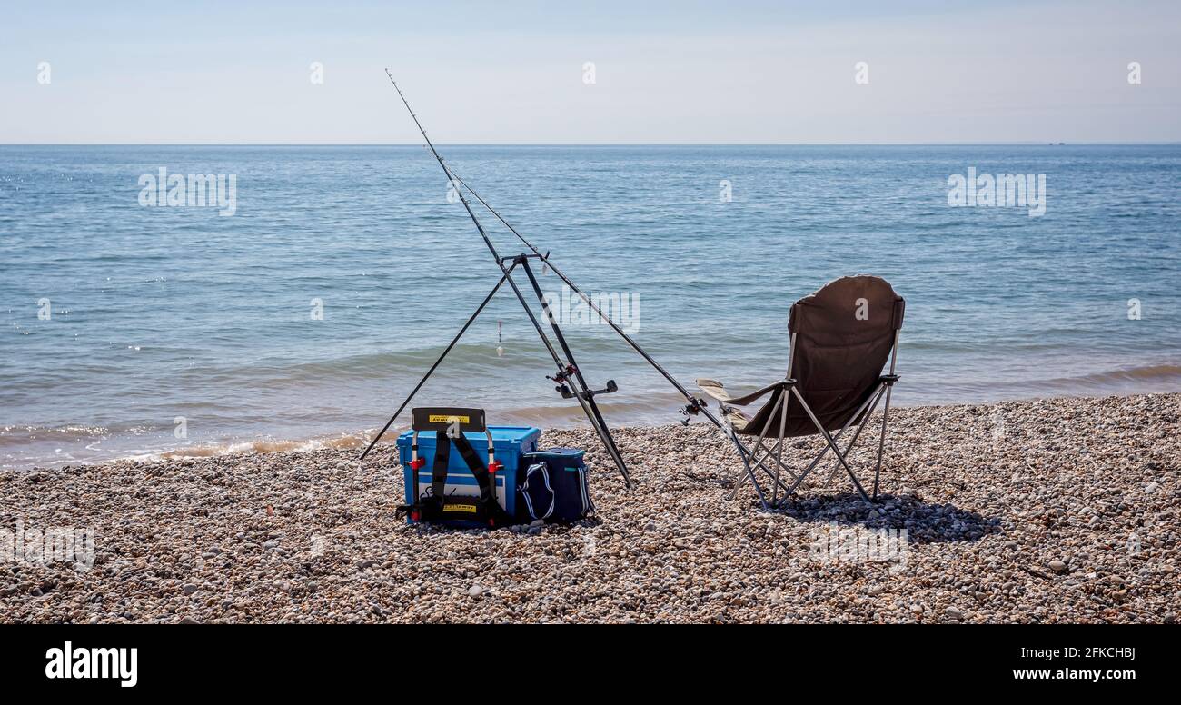 Pair of fishing rods set up on beach for sea fishing Stock Photo Alamy