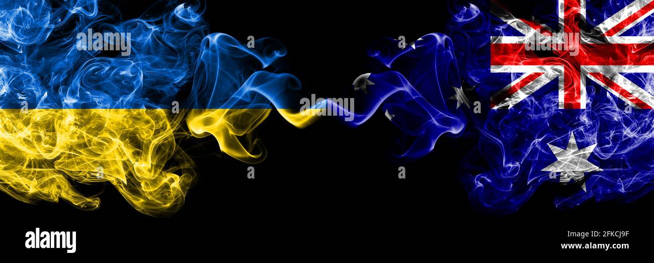 Ukraine, Ukrainian vs Australia, Australian smoky mystic flags placed side by side. Thick colored silky abstract smokes flags. Stock Photo