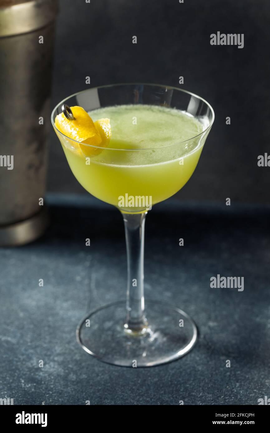 Boozy Refreshing Absinthe Necromancer Cocktail with  Lemon and Gin Stock Photo