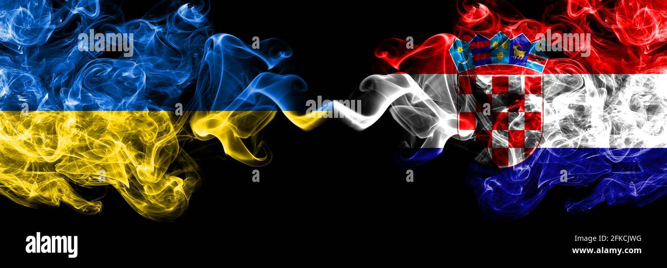 Ukraine, Ukrainian vs Croatia, Croatian smoky mystic flags placed side by side. Thick colored silky abstract smokes flags. Stock Photo