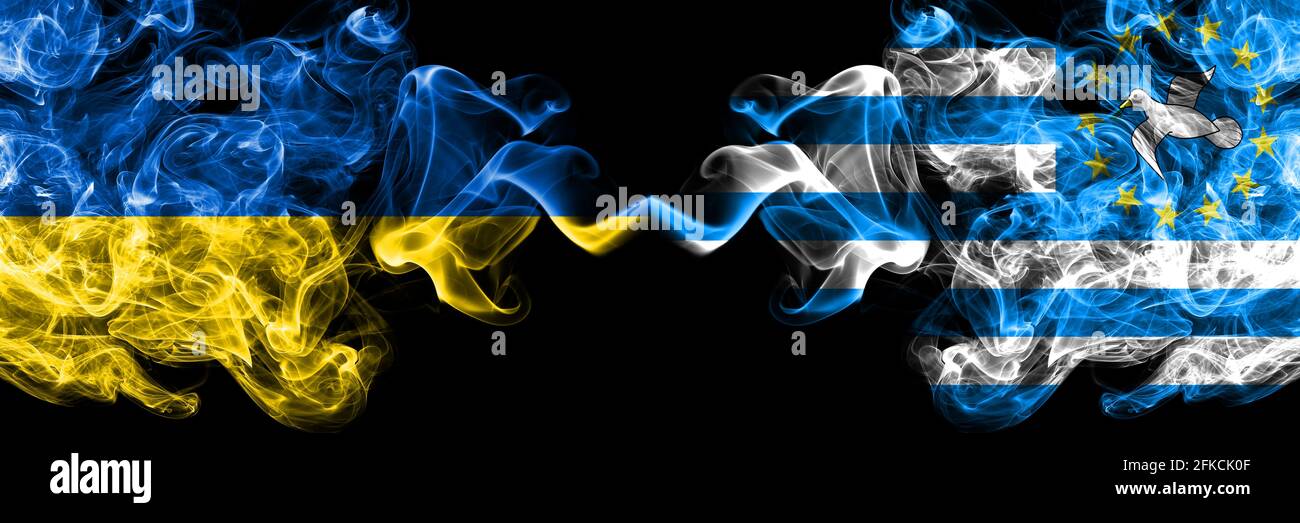 Ukraine, Ukrainian vs Federal Republic of Southern Cameroons smoky mystic flags placed side by side. Thick colored silky abstract smokes flags. Stock Photo