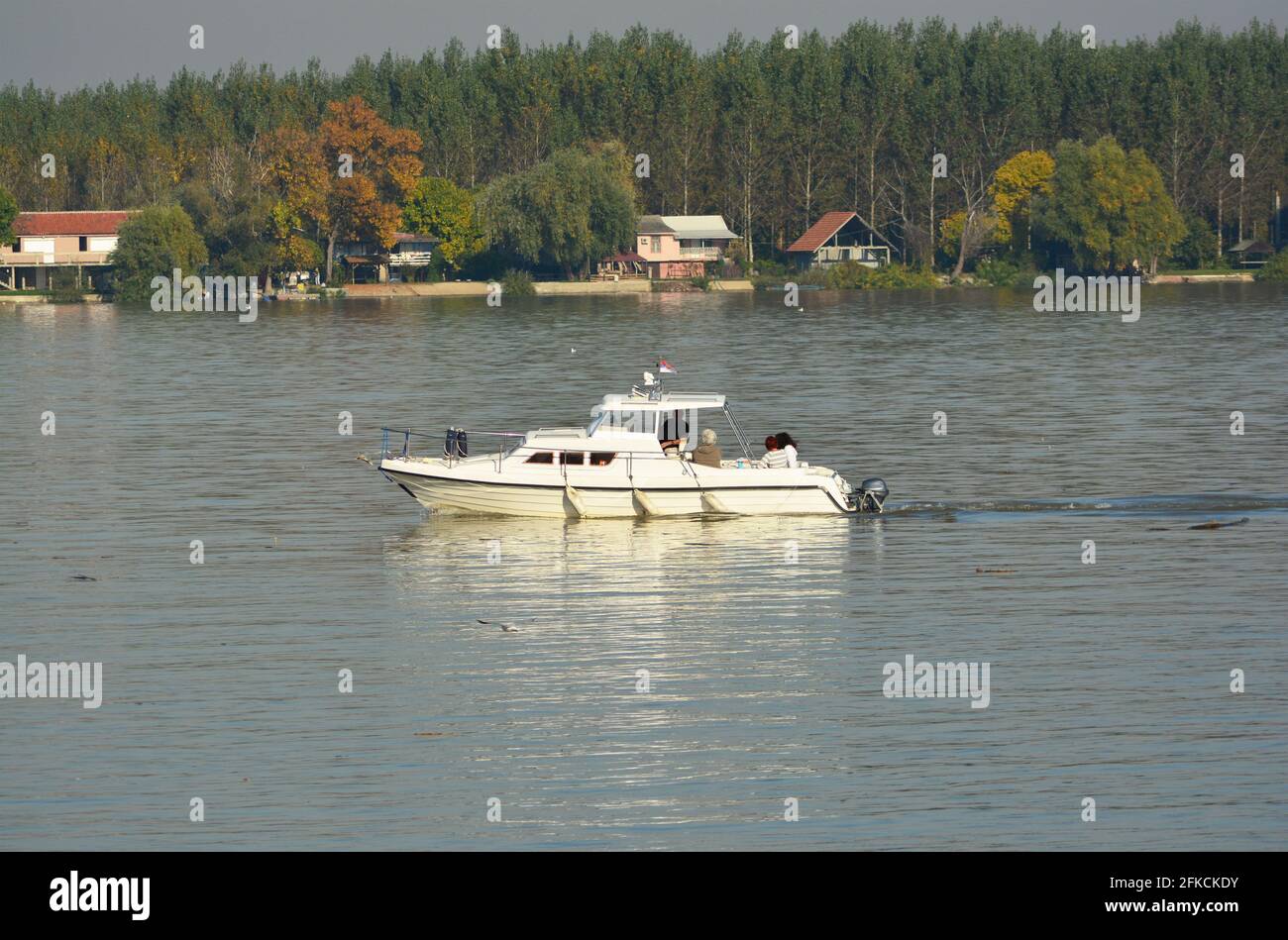 a speedboat on the river with unrecognizable persons Stock Photo