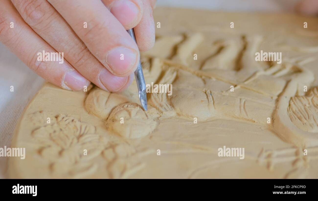 Potter making clay stamp picture Stock Photo Alamy
