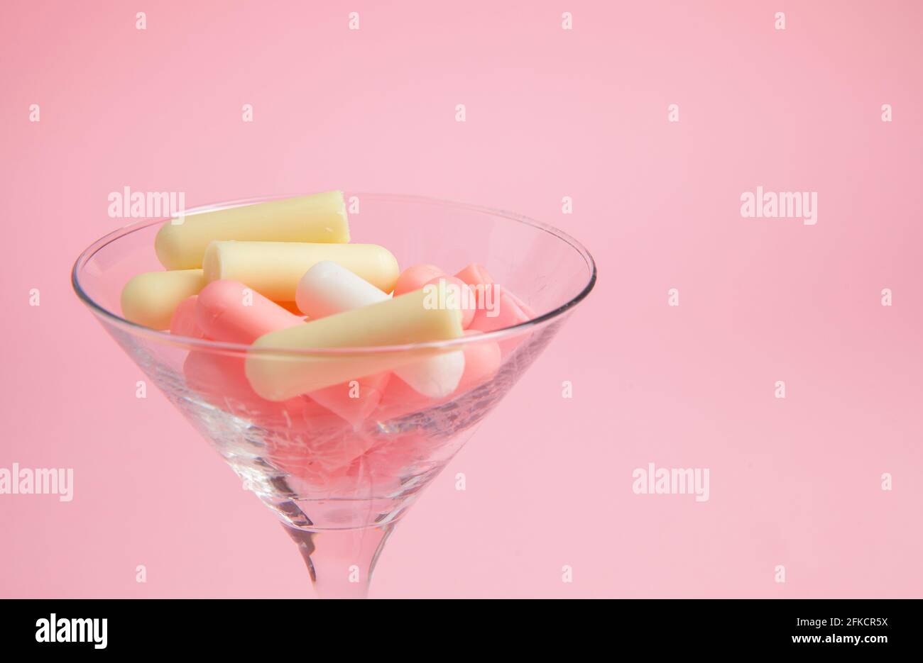 cosmetic background with cosmetic sticks and flovers in the glass, close up Stock Photo