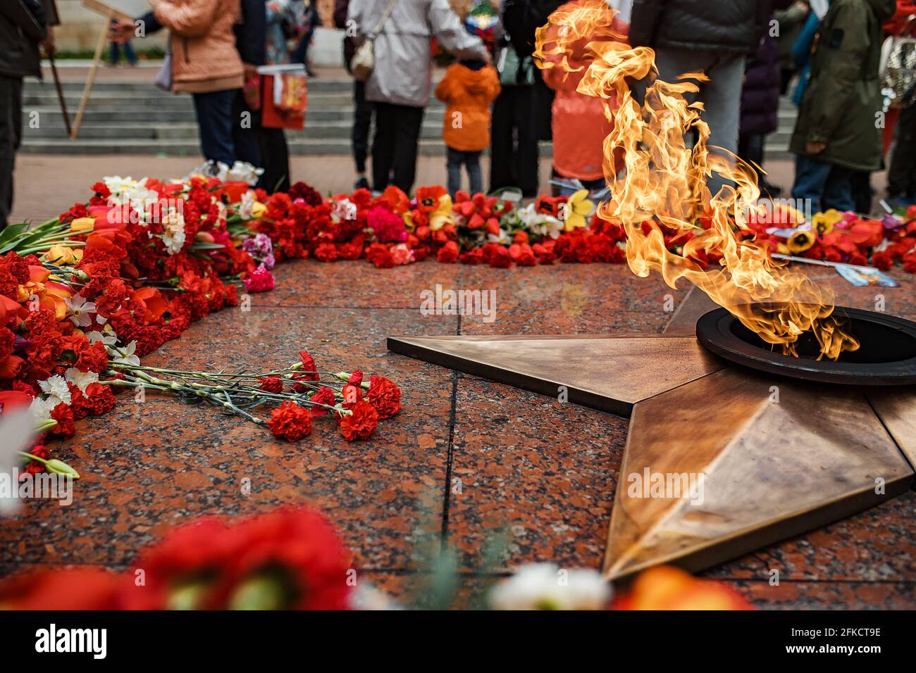 flowers at the memorial fire. the memory of the fallen soldiers in the