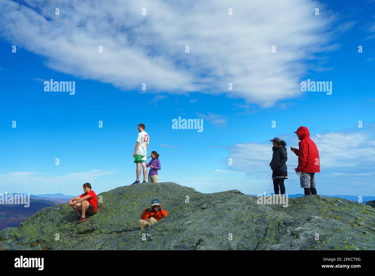 Hikers on the rocky summit of Camel's Hump, Vermont, USA. Stock Photo