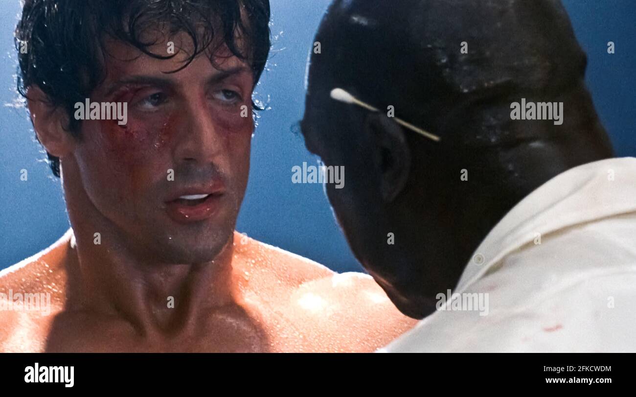 USA. Sylvester Stallone and Tony Burton in a scene from (C)MGM/UA film:  Rocky IV (1985). Plot: Rocky Balboa proudly holds the world heavyweight  boxing championship, but a new challenger has stepped forward:
