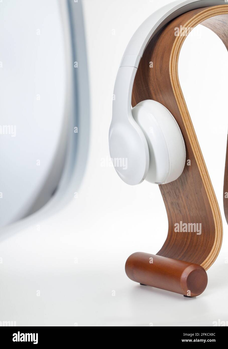 hifi-headphones-high-fidelity-on-a-wooden-omega-stand-isolated-on
