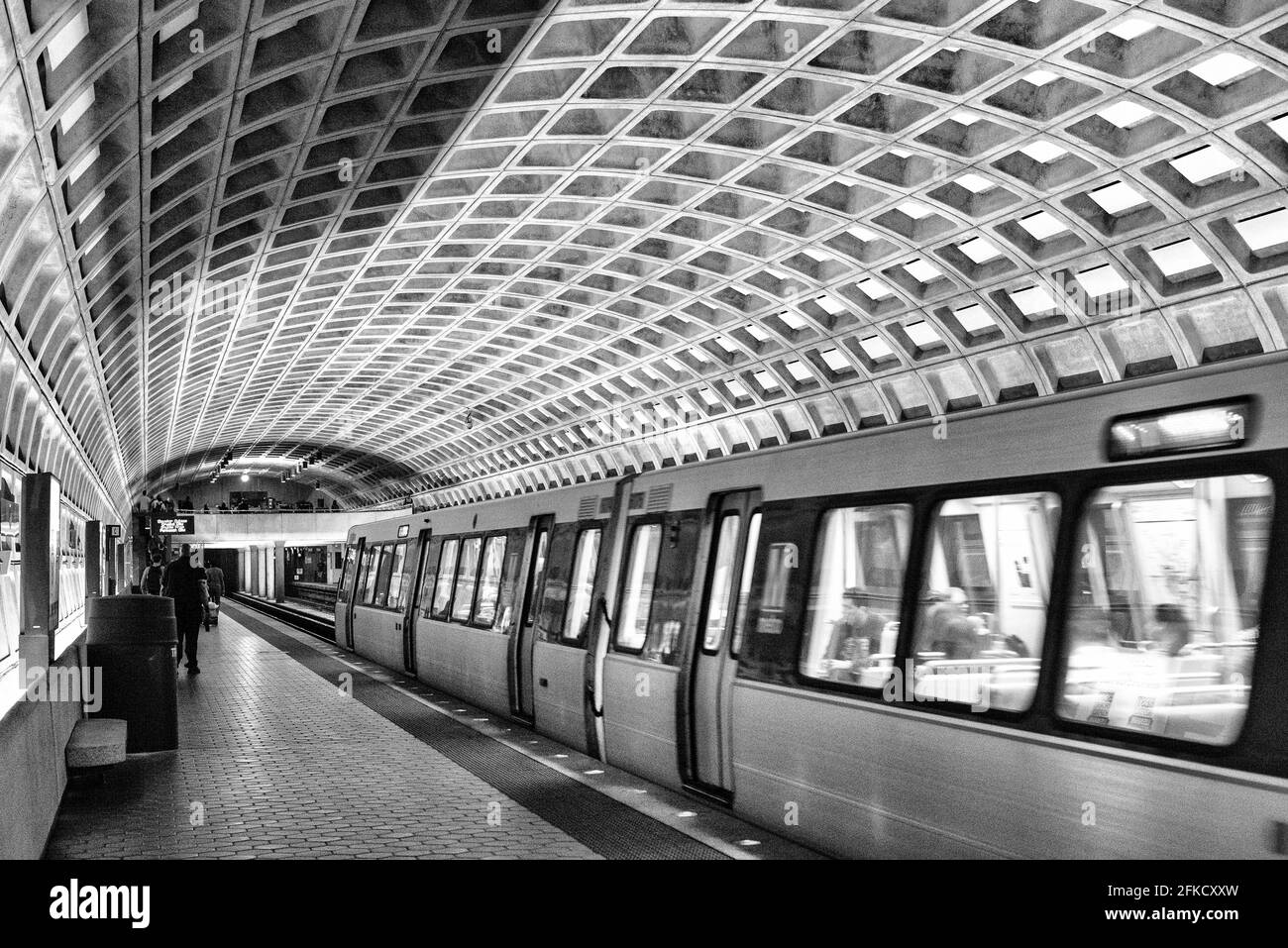 A train leaves the platform at one of the distinctive domed stations of