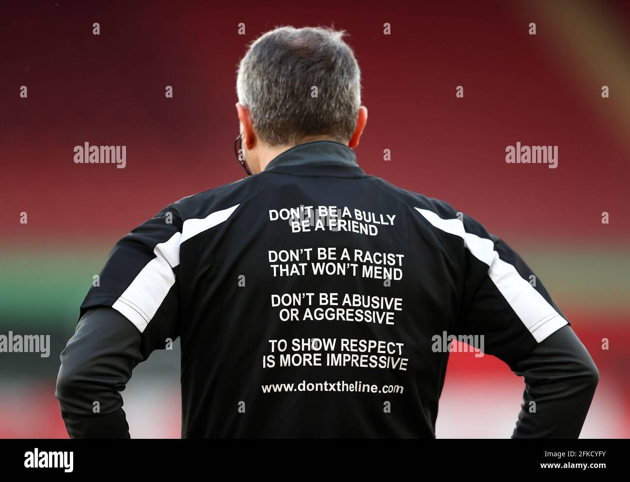 Match official Darren Cann warms up wearing an anti racism dontxtheline top before the Premier League match at St. Mary's Stadium, Southampton. Picture date: Friday April 30, 2021. Stock Photo
