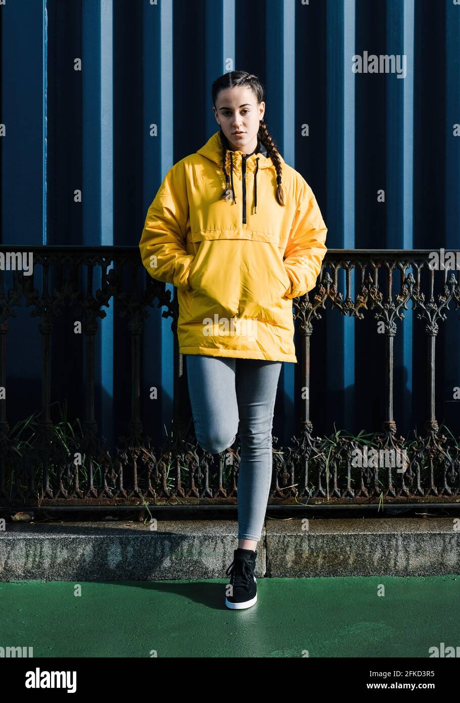 Portrait of teenage girl in yellow coat Stock Photo