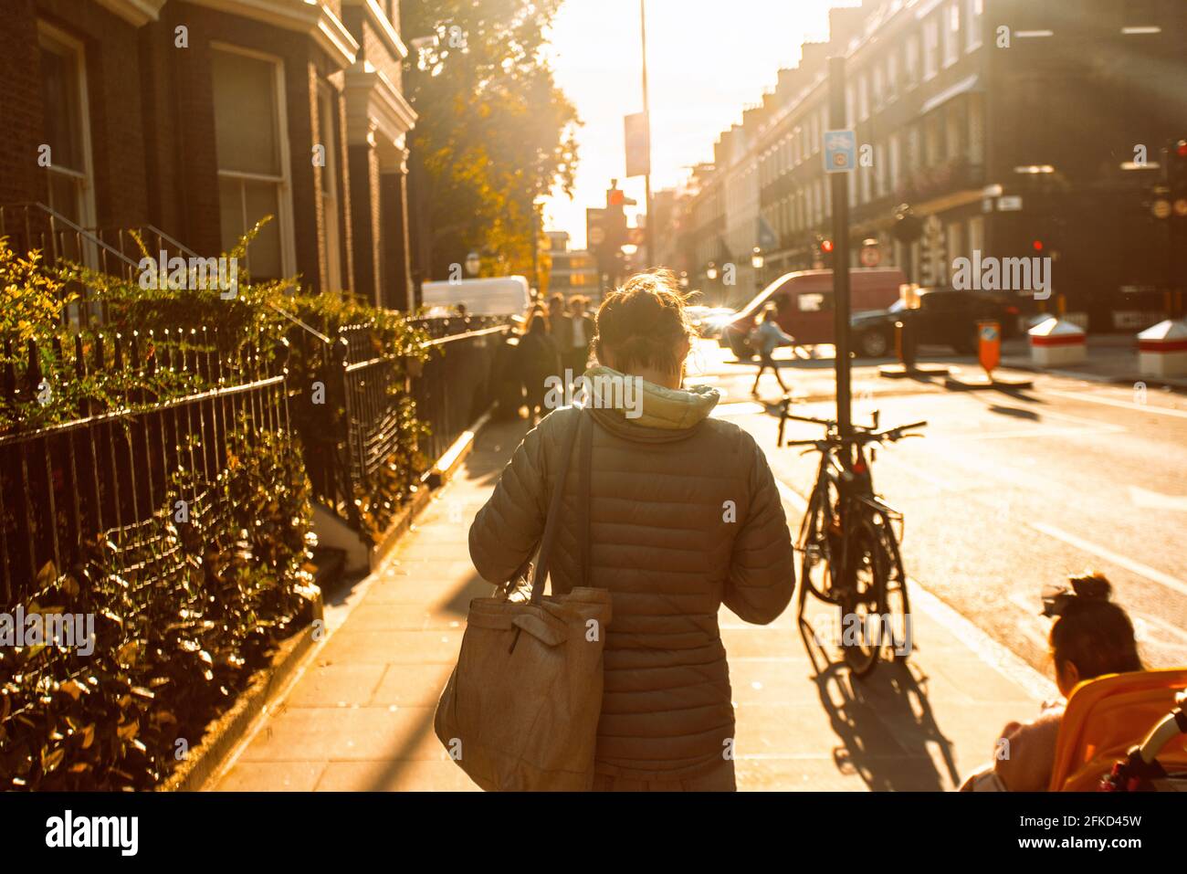 Woman street rear sunset hi-res stock photography and images - Alamy