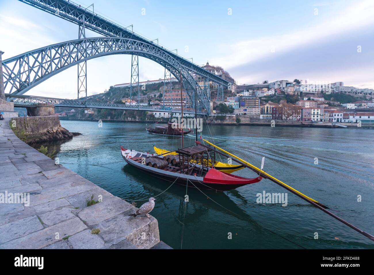 Portugal, Porto, Rabelo boats on Douro river with Dom Lus I Bridge in background Stock Photo