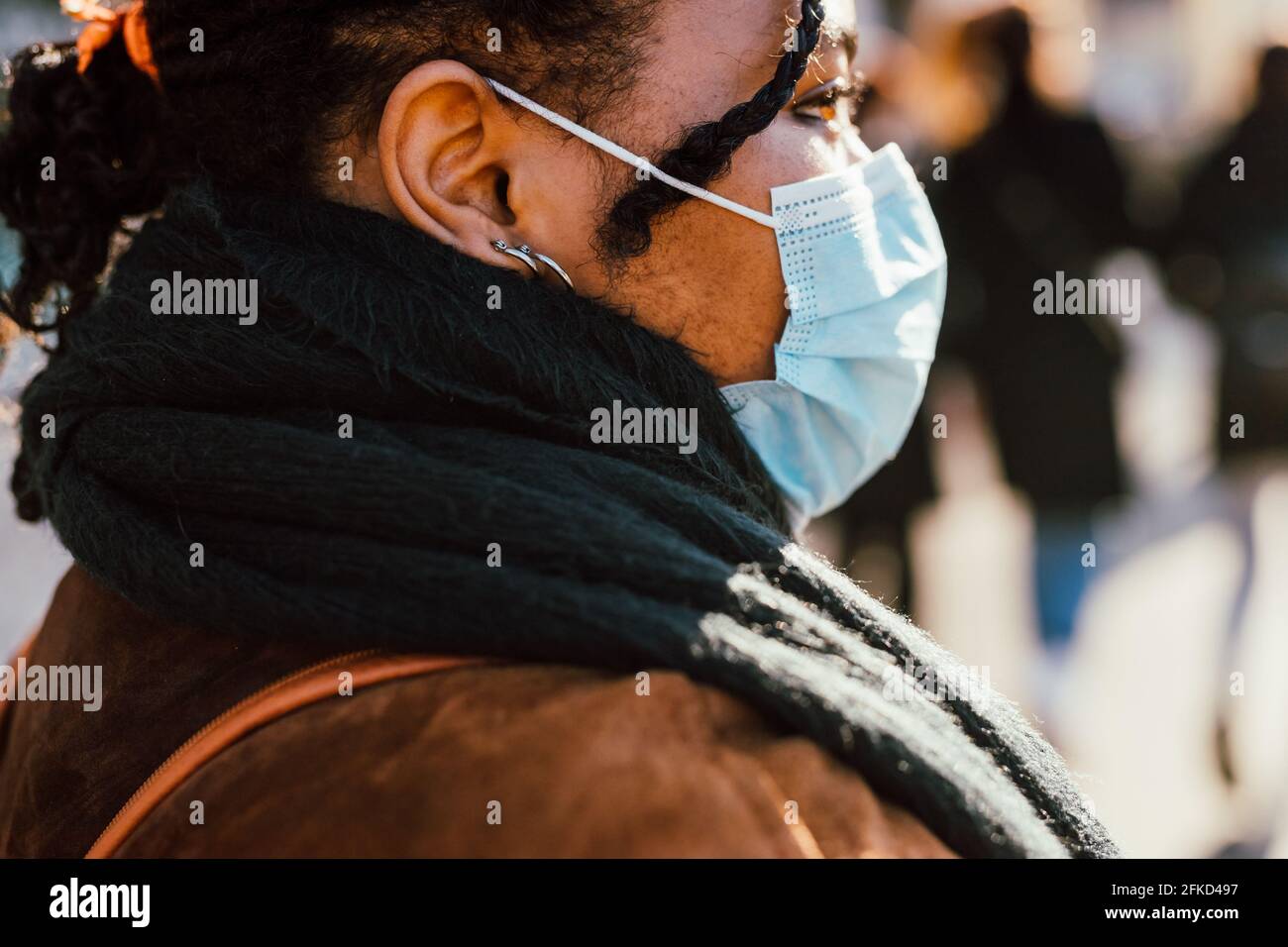 Woman wearing face mask outdoors Stock Photo Alamy