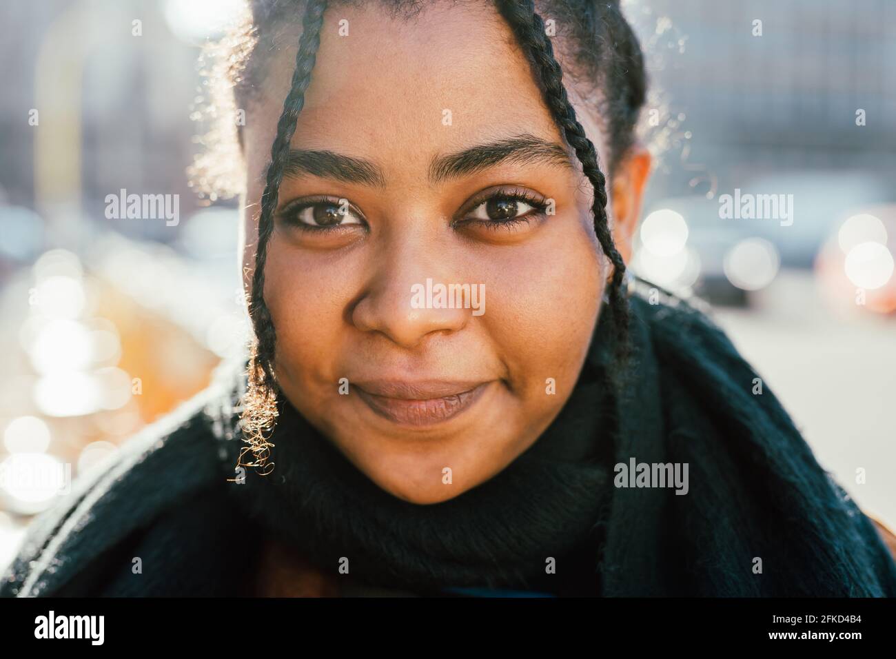 Portrait of smiling young woman outdoors Stock Photo - Alamy