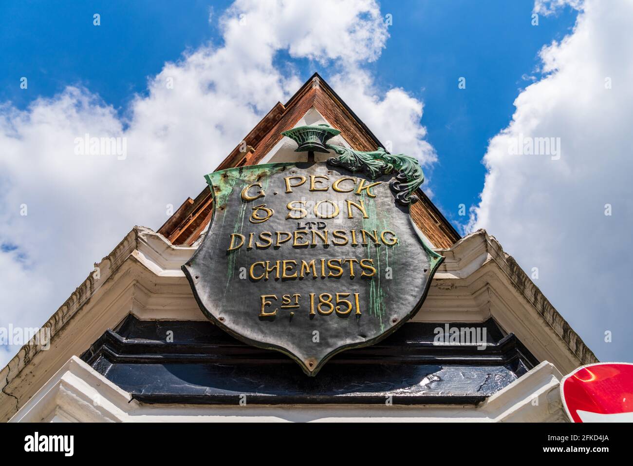 Vintage Dispensing Chemist or Pharmacy Sign Cambridge UK. G Peck & Son Dispensing Chemist Est. 1851. The building still operates as a pharmacy. Stock Photo