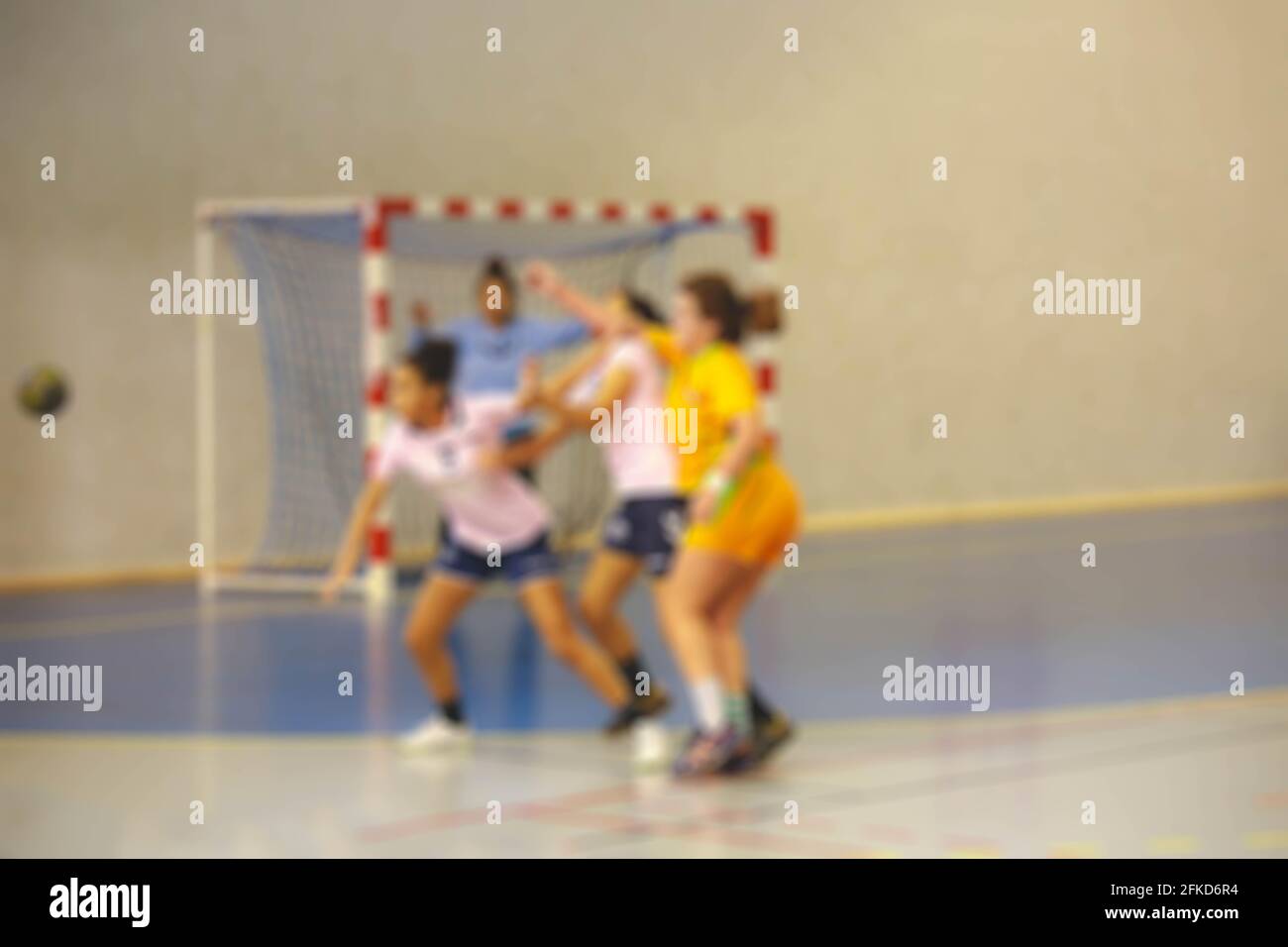 Blurred image of women handball players in action Stock Photo