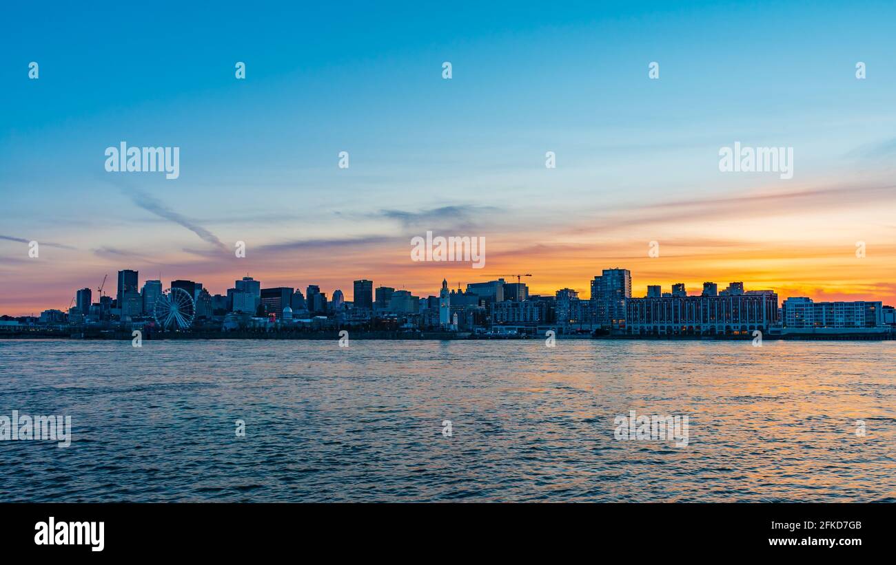 Beautiful sunset view over Montreal's skyline as seen from  Jean-Drapeau park Stock Photo