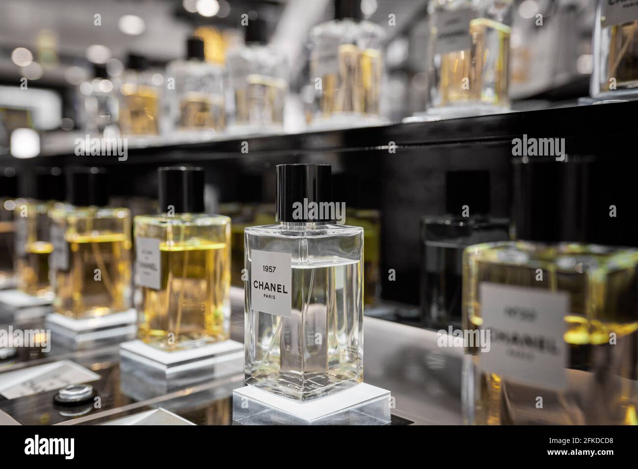 Female perfume Chanel No. 22 bottle closeup in store showcase. Perspective view of french Chanel perfume collection. Milan, Italy - December 15, 2020. Stock Photo