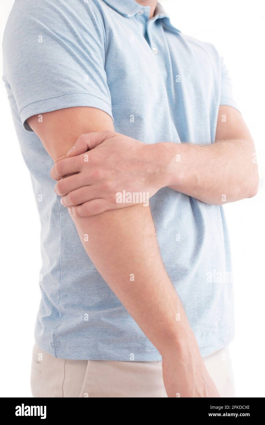 Man holding his elbow in pain Stock Photo