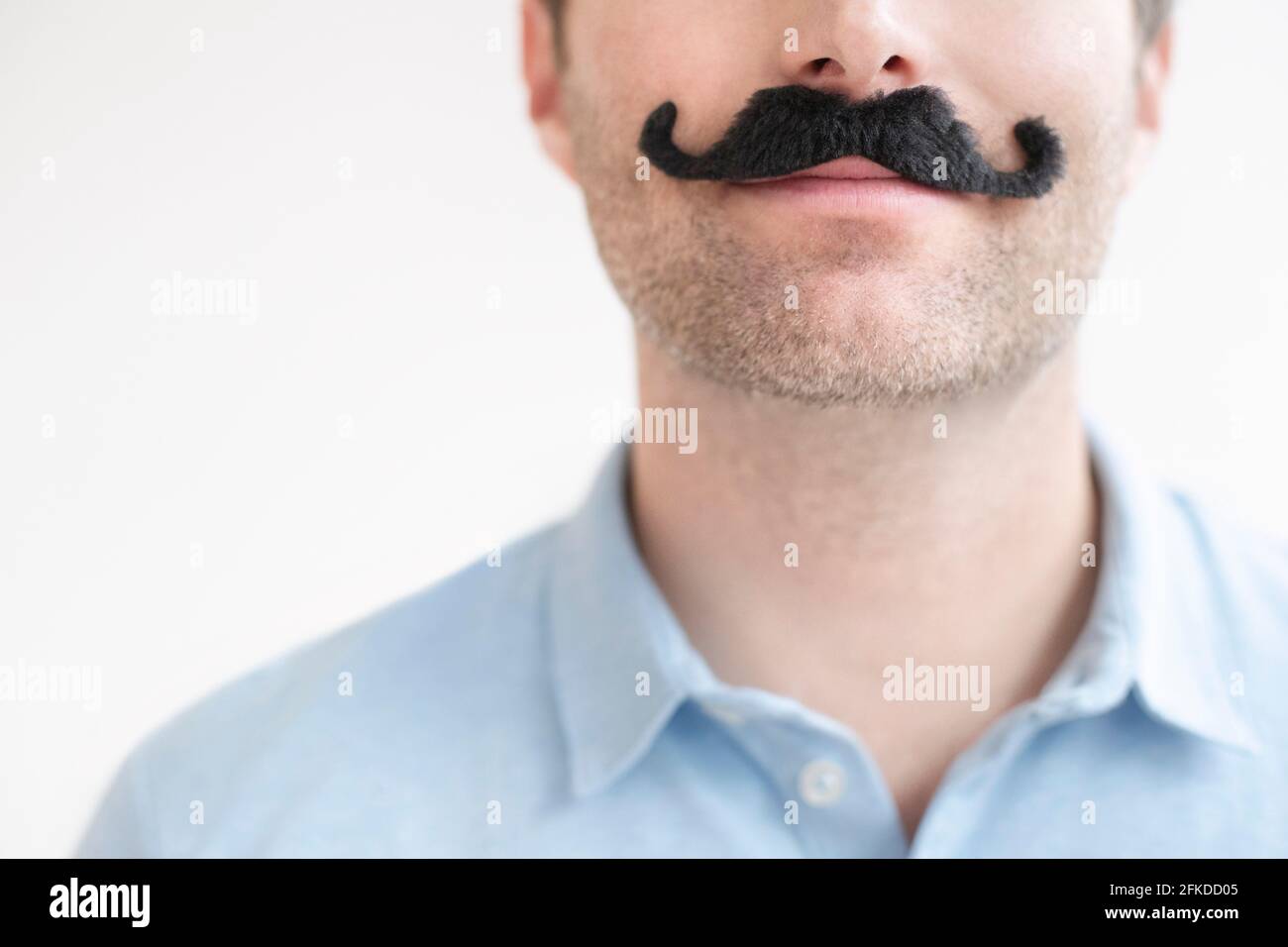 Man with fake moustache Stock Photo