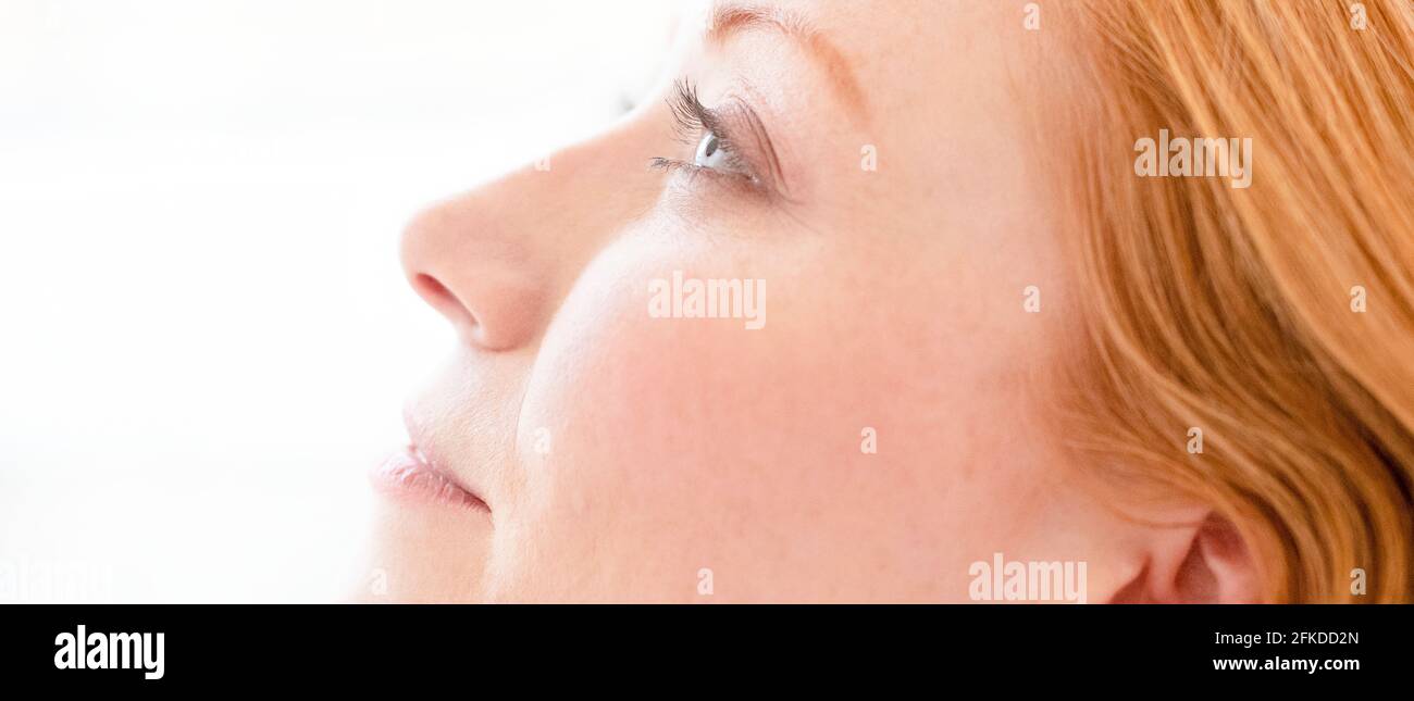 Woman with head titled back Stock Photo