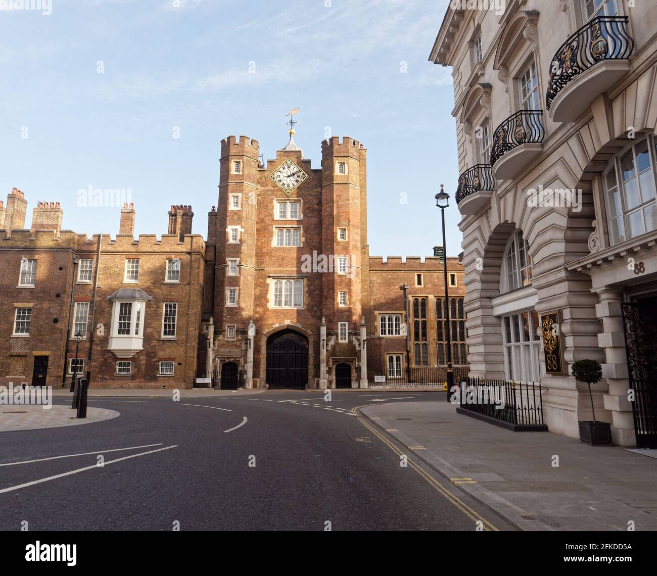 London, Greater London, England - Apr 24 2021: St James's Palace facade at the corner of Pall Mall and St James's Street with a property with a balcon Stock Photo