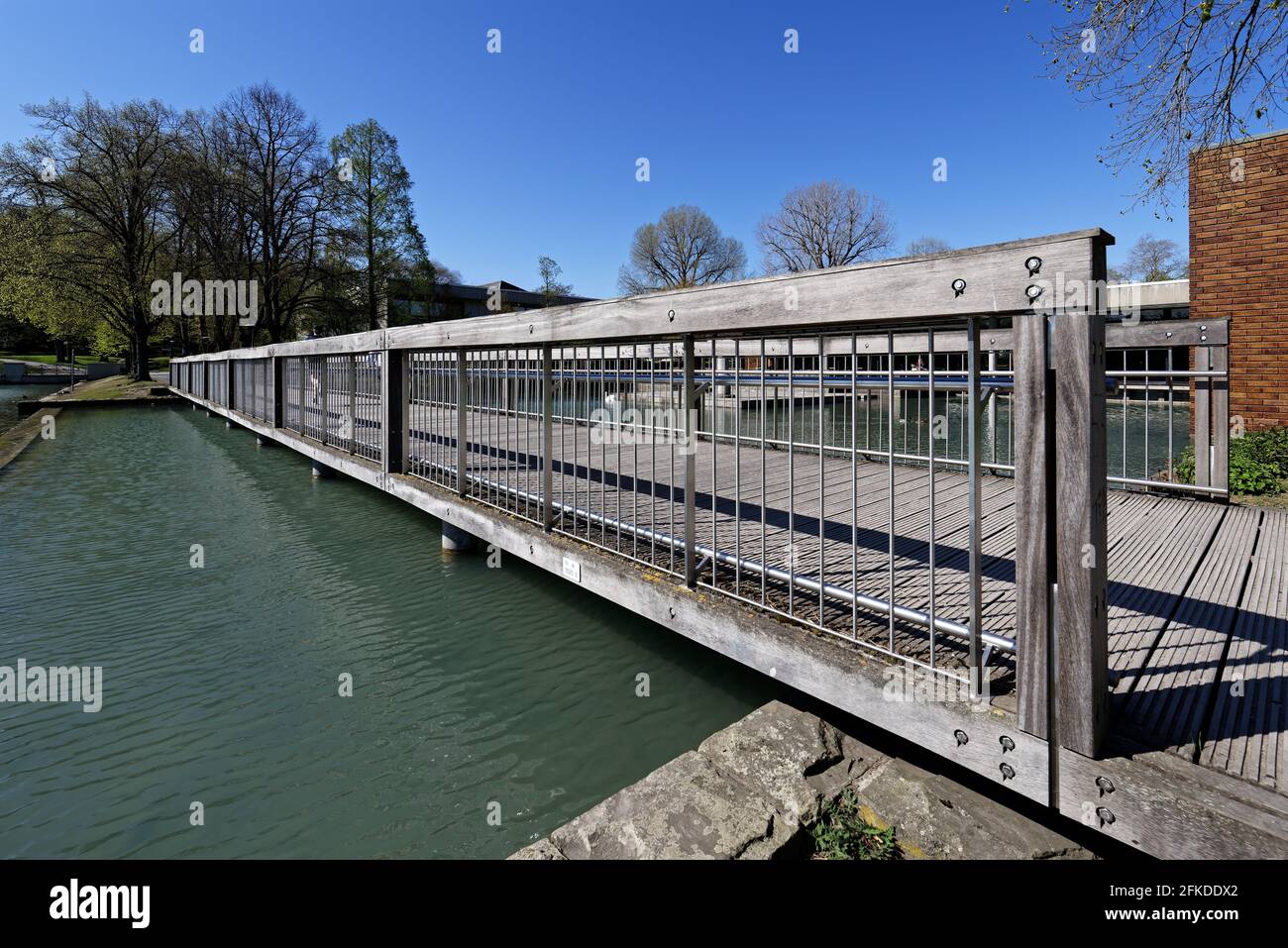 wooden bridge over a pond in cologne Stock Photo