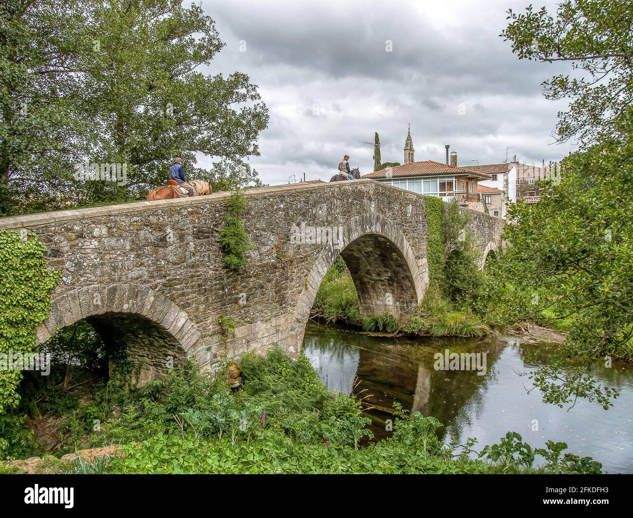 The Camino by horse over Puente de San Xoan de Furelos, Spain, July 23, 2021 Stock Photo