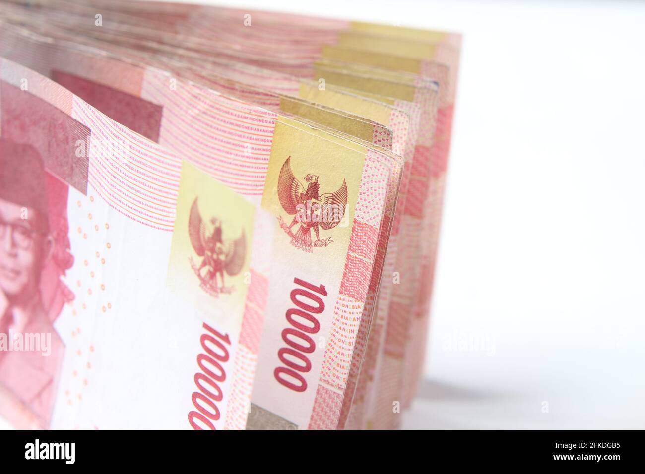 Photo Rupiah Paper Money, Close Up of 100000 at White Background Stock Photo