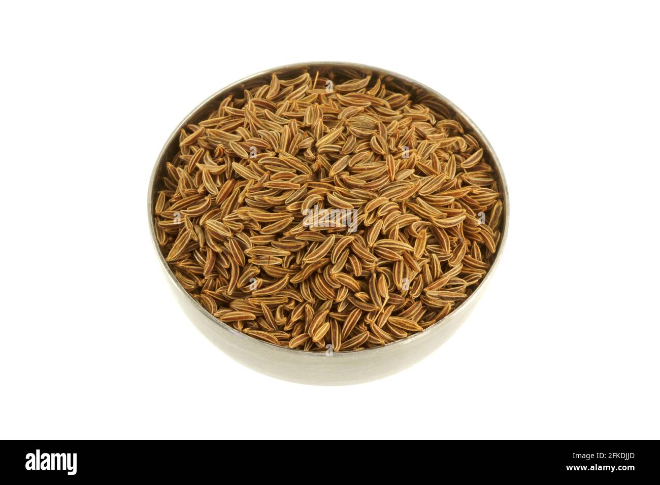 Closeup photo of a bowl of dried aromatic herb Caraway seeds Stock Photo