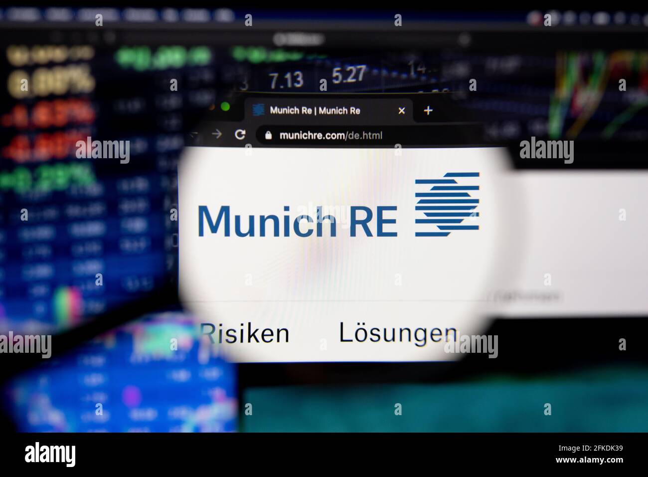 Munich RE, Münchner Rück company logo on a website with blurry stock market developments in the background, seen on a computer screen Stock Photo