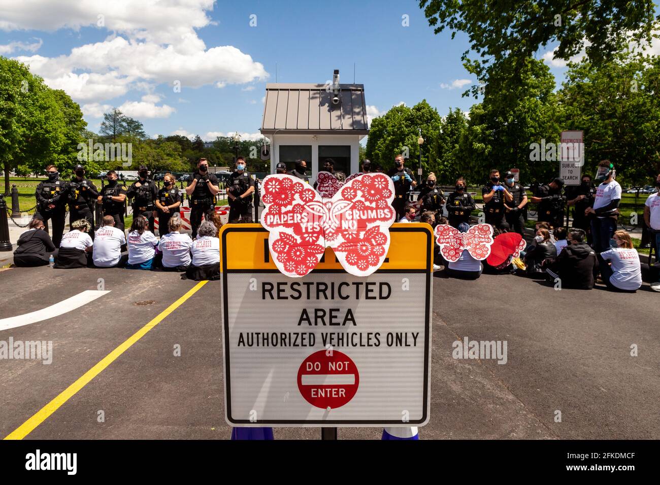 Washington, DC, United States.  Pictured: Immigrants and supporters from Cosecha chapters around the country protest the lack of action on immigration on the 100th day of Biden’s administration.  Credit: Allison C Bailey / Alamy Live News Stock Photo