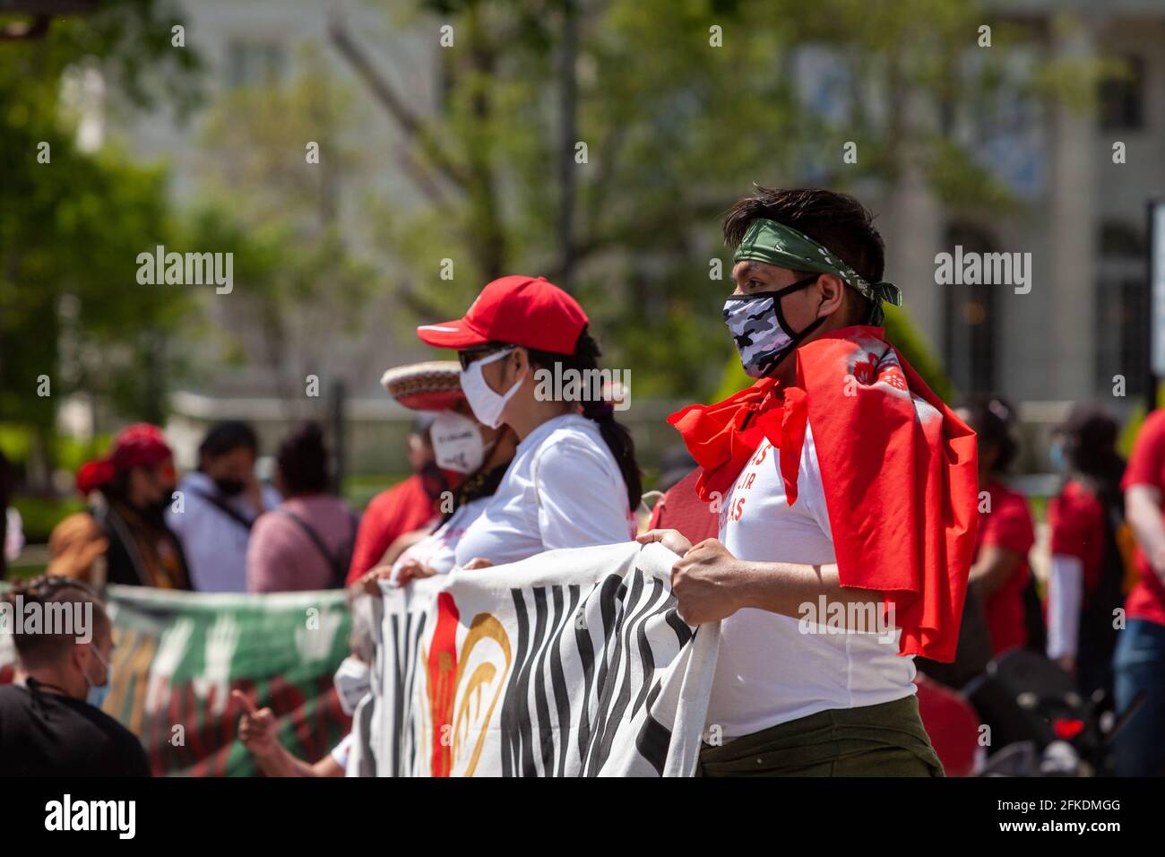 Washington, DC, United States.  Pictured: Immigrants and supporters from Cosecha chapters around the country protest the lack of action on immigration on the 100th day of Biden’s administration.  Credit: Allison C Bailey / Alamy Live News Stock Photo
