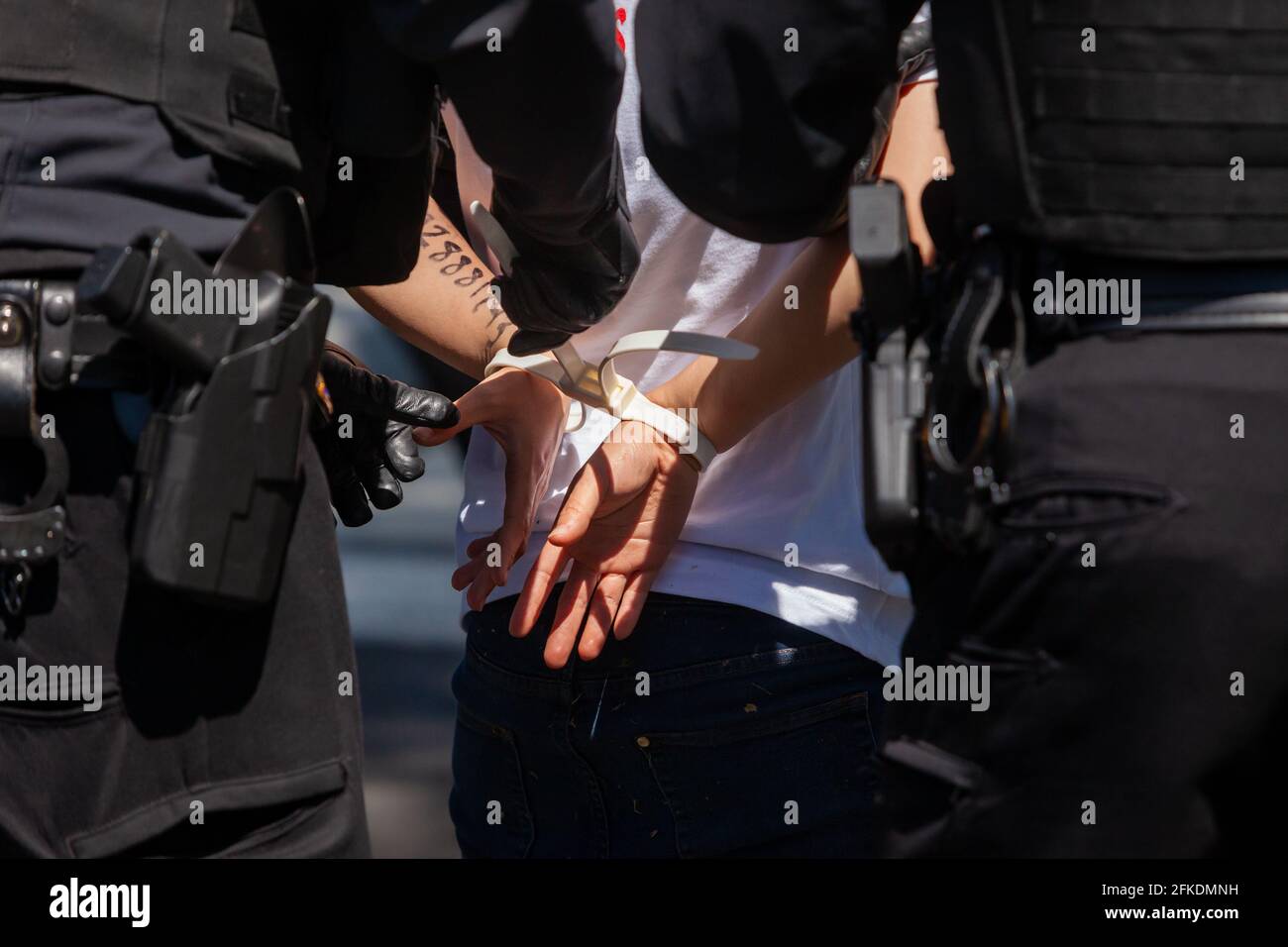 Washington, DC, United States.  Pictured: Activists are arrested by US Secret Service officers for blocking an entrance to the White House in a civil disobedience action.  Immigrants and supporters from Cosecha chapters around the country protest the lack of action on immigration on the 100th day of Biden’s administration.  Credit: Allison C Bailey / Alamy Live News Stock Photo