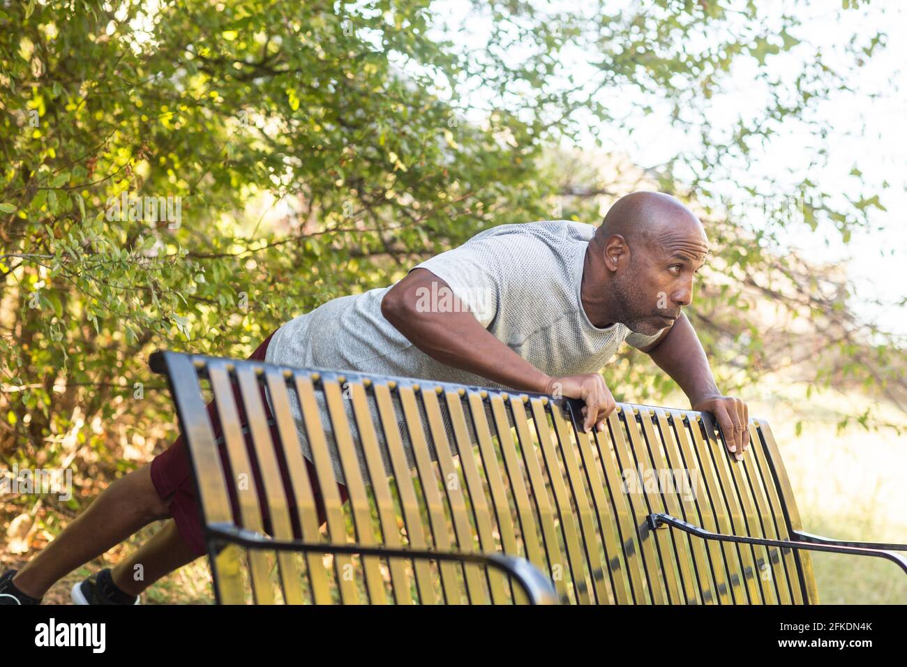 Mature African American working out and doing push ups. Stock Photo